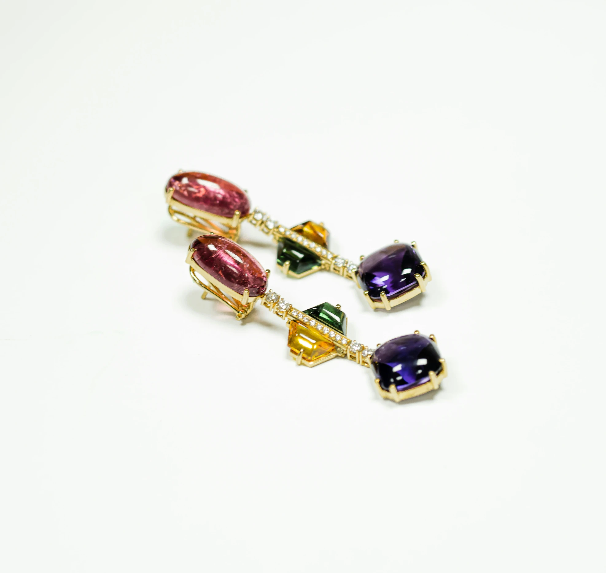 three pairs of dangling earrings with multicolored glass stones