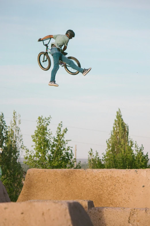 a man riding a bike high in the air