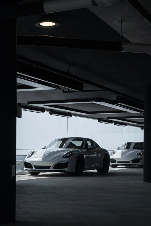 a parking lot with three cars in it