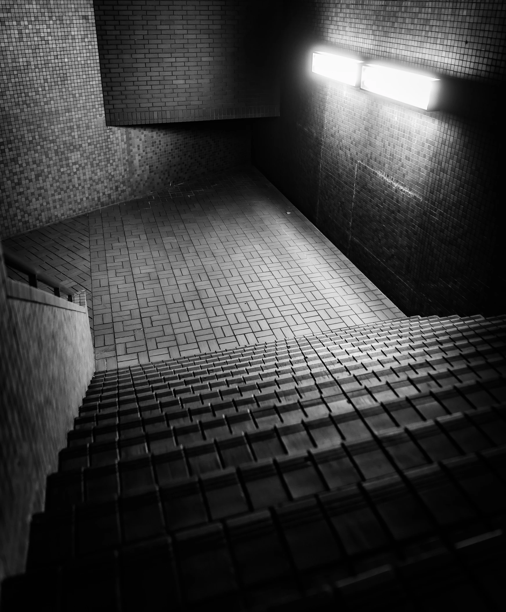 a building with some kind of brick floor under light