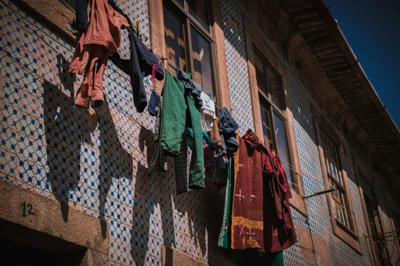 laundry hanging outside an old building, in an indian country