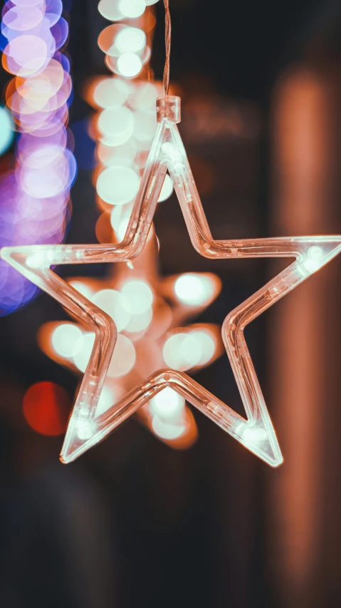 a christmas ornament is shown with blurry lights