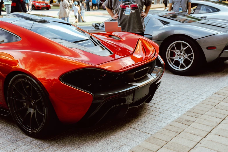 there are two red cars parked near each other