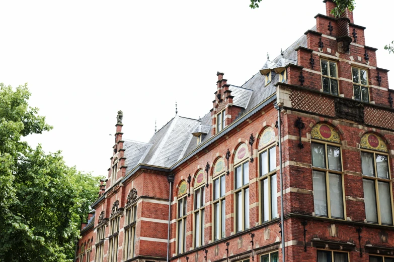an old red brick building with lots of windows