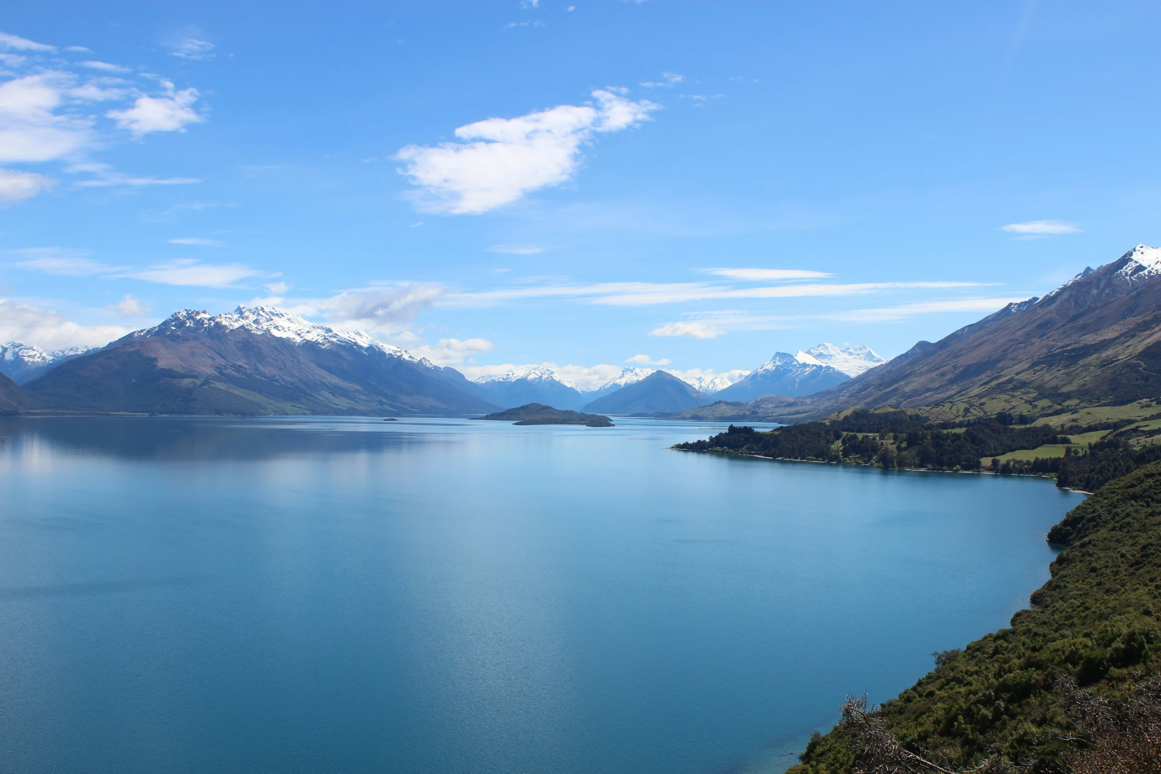 the mountains surrounding the lake look very majestic