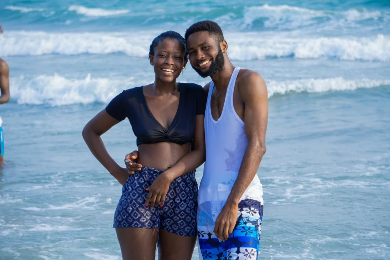 two friends enjoying the beach and taking a po