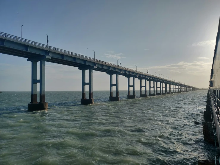 the ocean and bridge over the water at day time