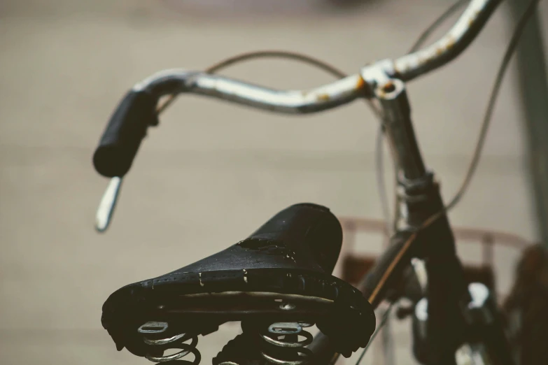 a close - up of a bicycle's seat with a handlebar