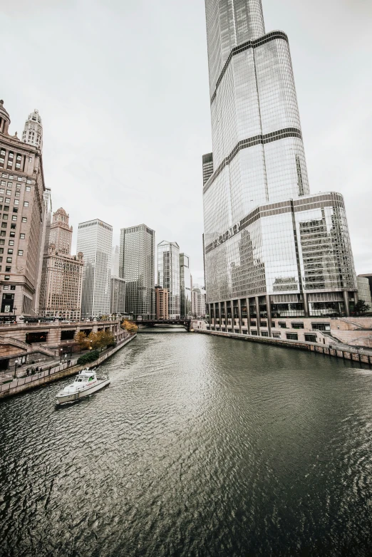 some buildings water and a river on a cloudy day