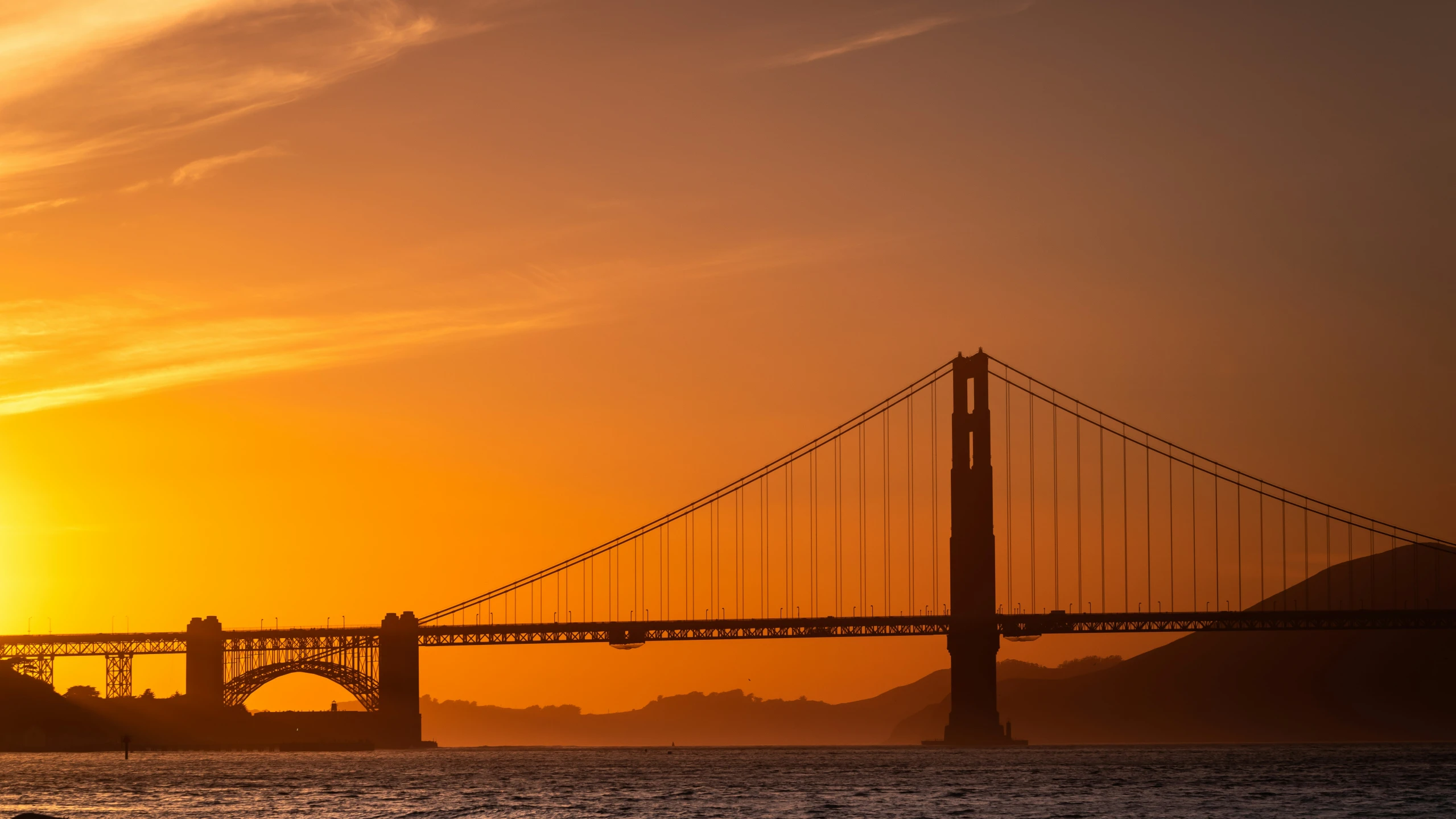 a large long bridge with a tall structure