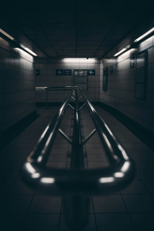 an empty subway tunnel with the rails slightly extended