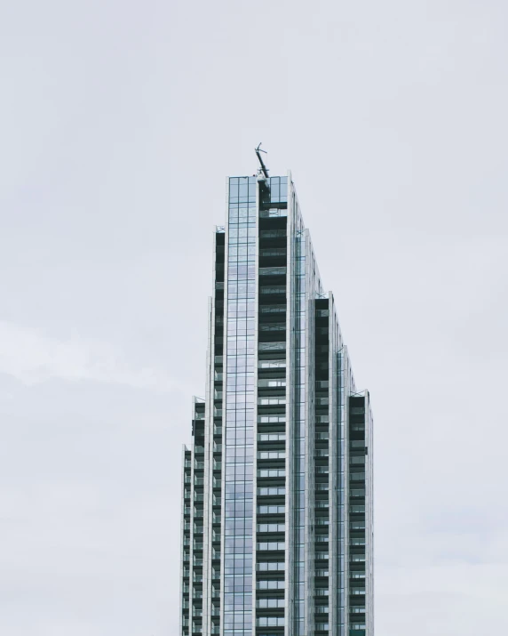 a tall skyscr with glass windows in a city