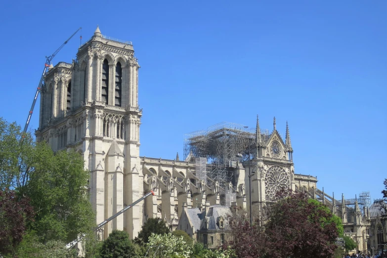 there is a large church tower next to the street