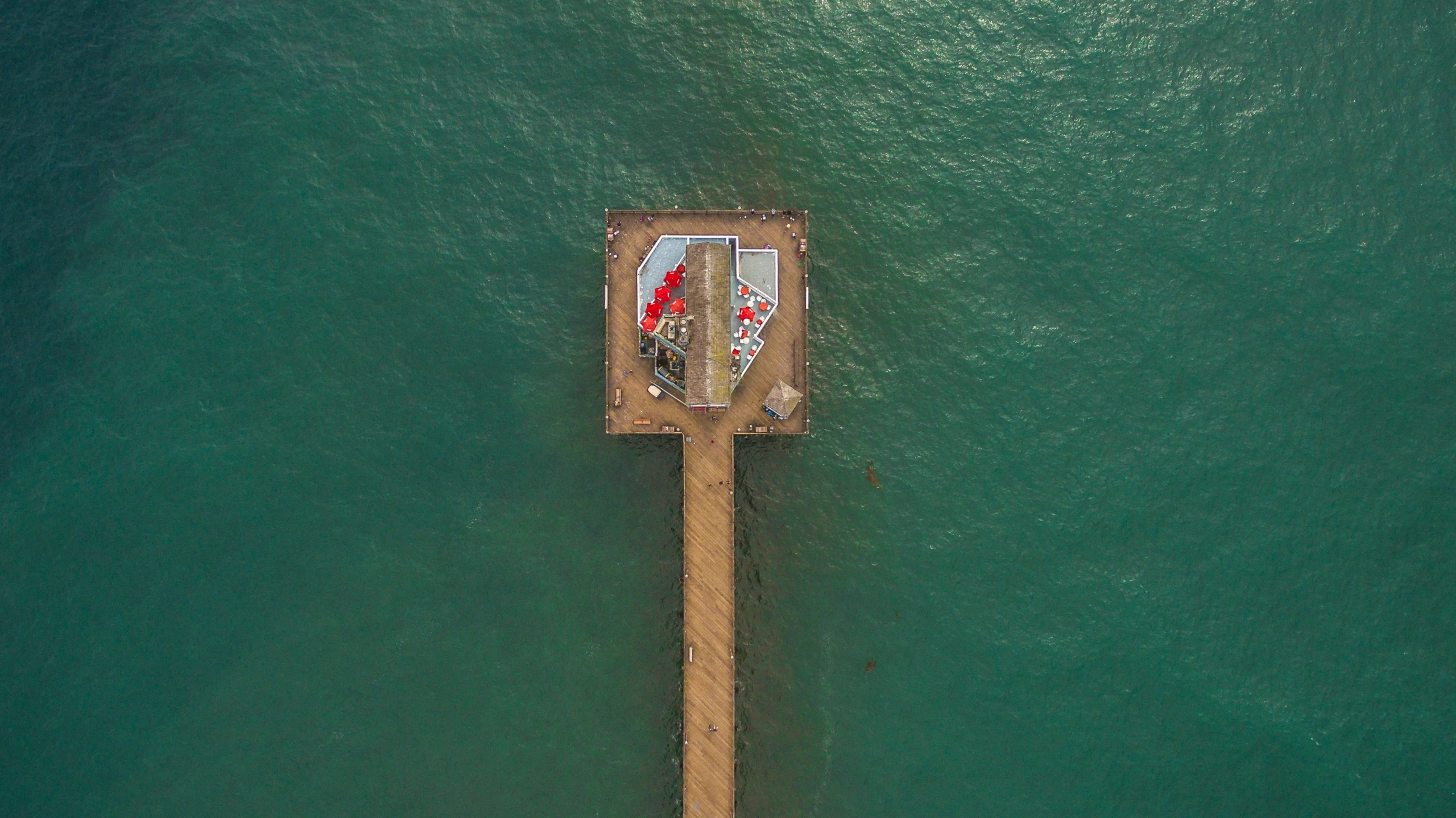 a wooden dock extending into a large body of water