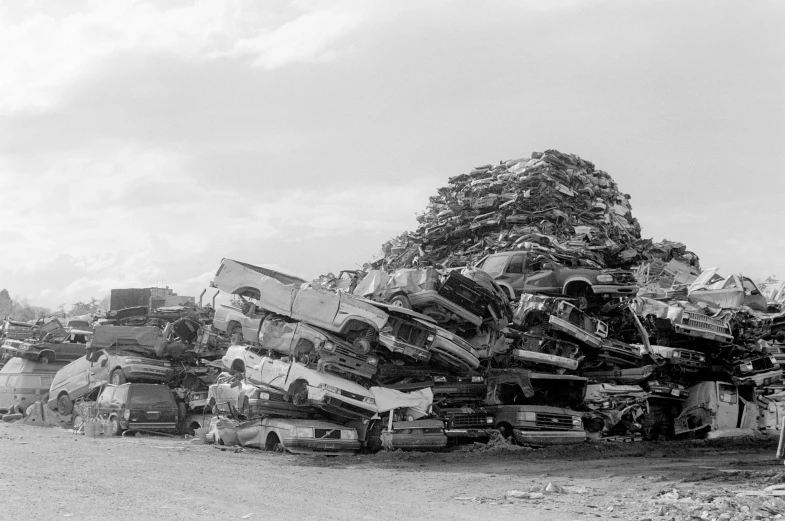 black and white pograph of a truck carrying many pieces of luggage