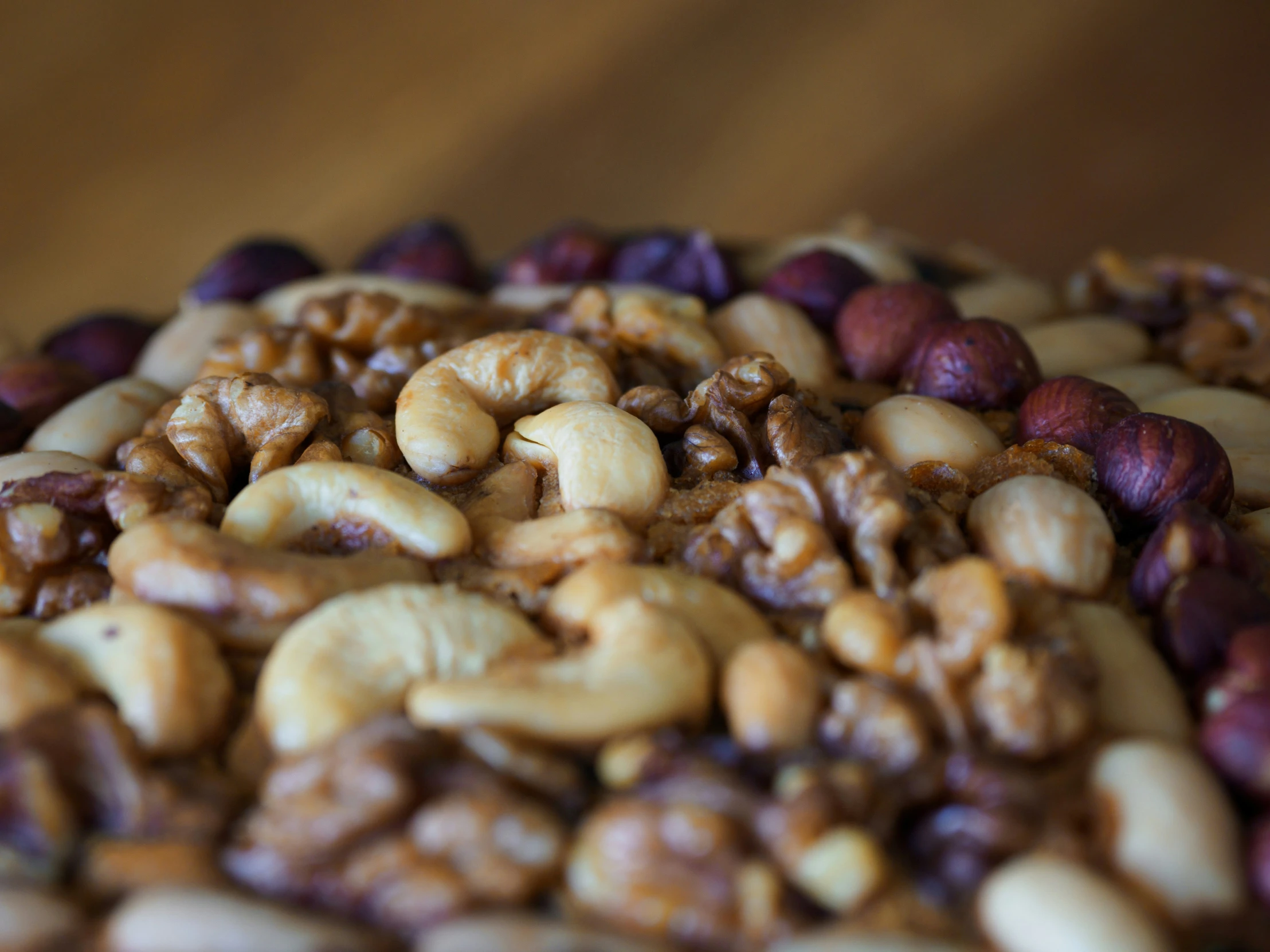 a pile of nuts and raisins next to some brownies