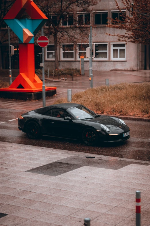 a car sitting in the middle of a street