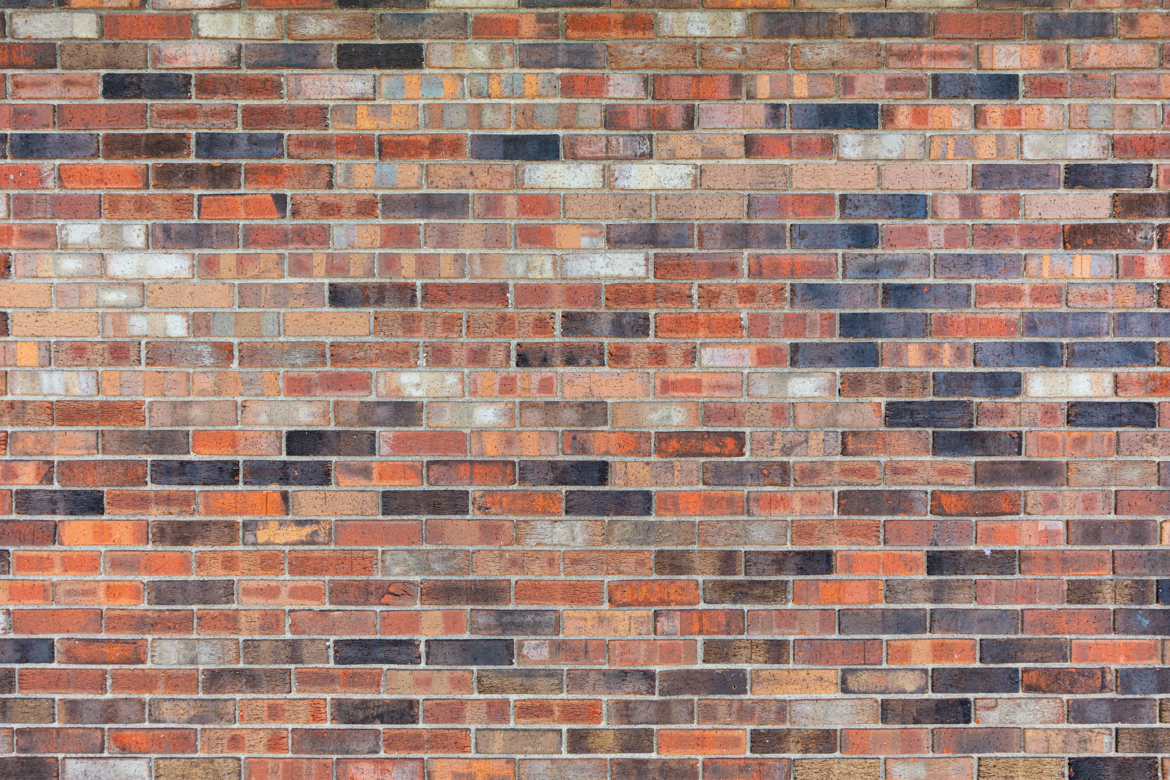 a pograph of an old, stained brick wall