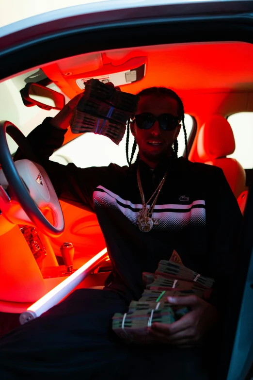 woman sitting inside car with stacks of money