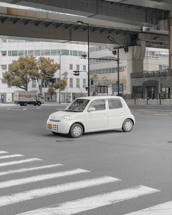 an electric car moving down the street in a city