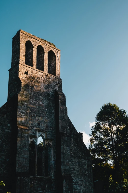 a large old stone church with a tower at the top