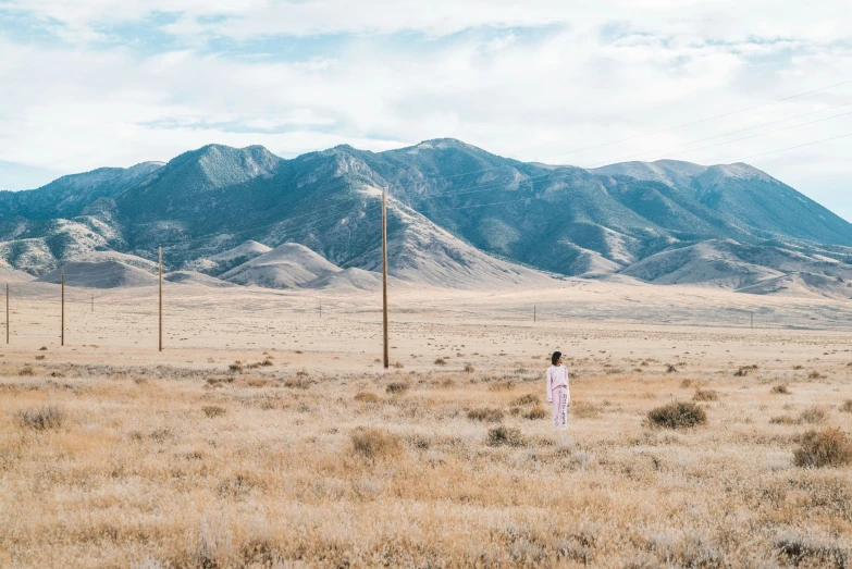 woman looking at mountains in front of them