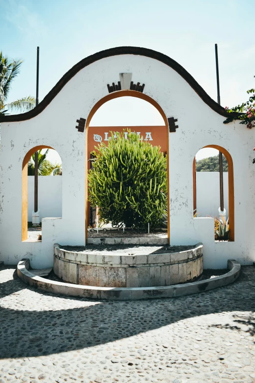 the entrance to an outdoor park with a circular walkway