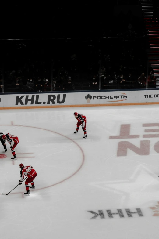 a group of people on ice hockey playing