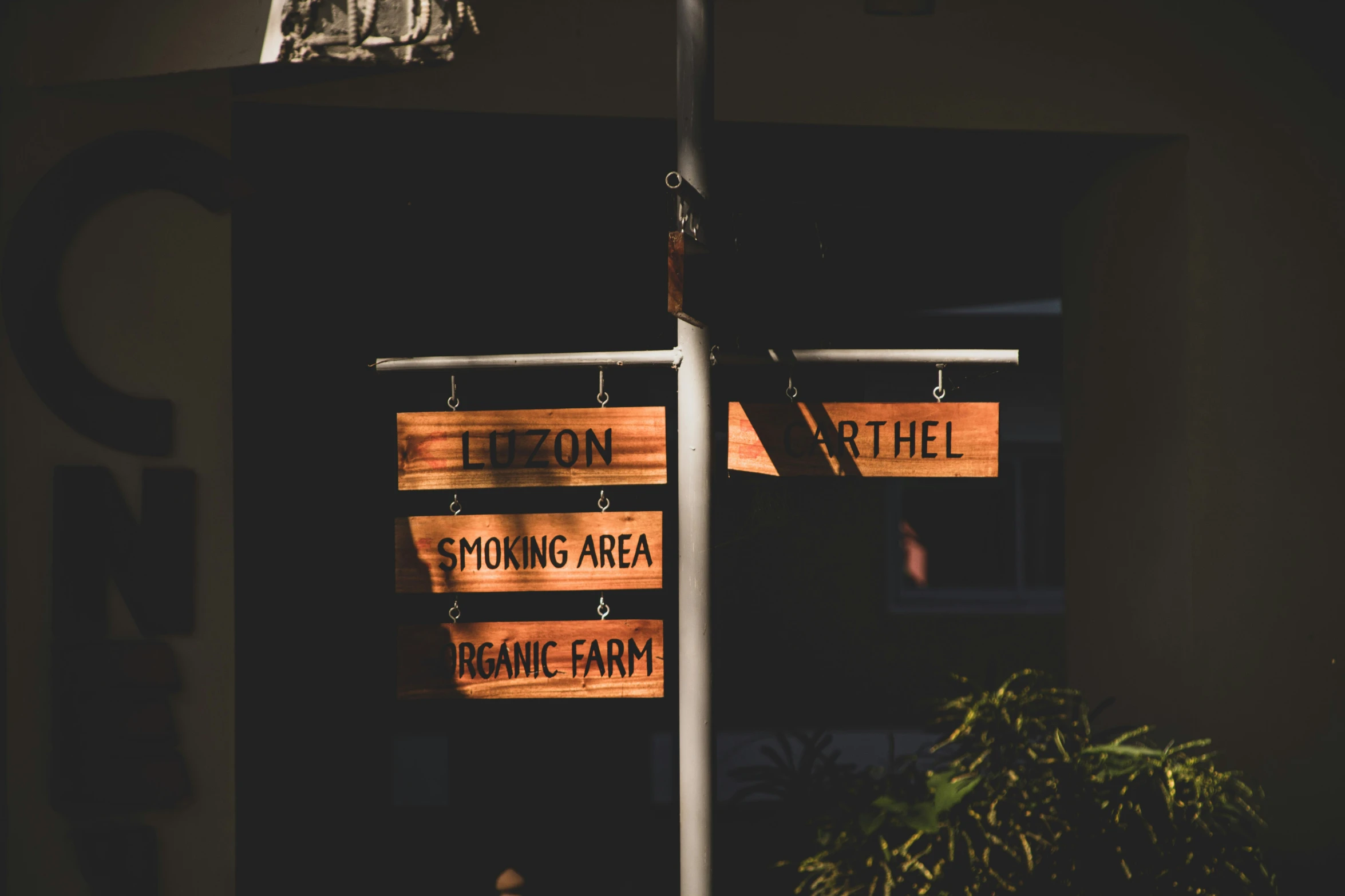 a couple of street signs are hanging on a pole