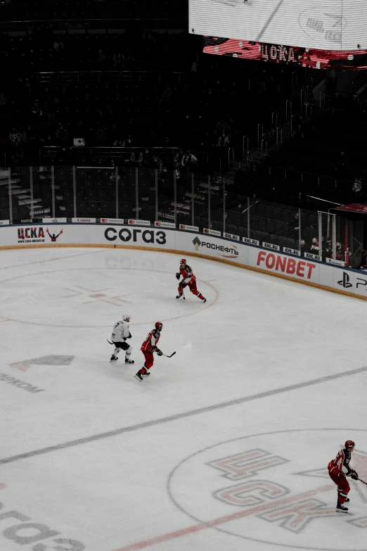 an ice hockey match going on in the rink