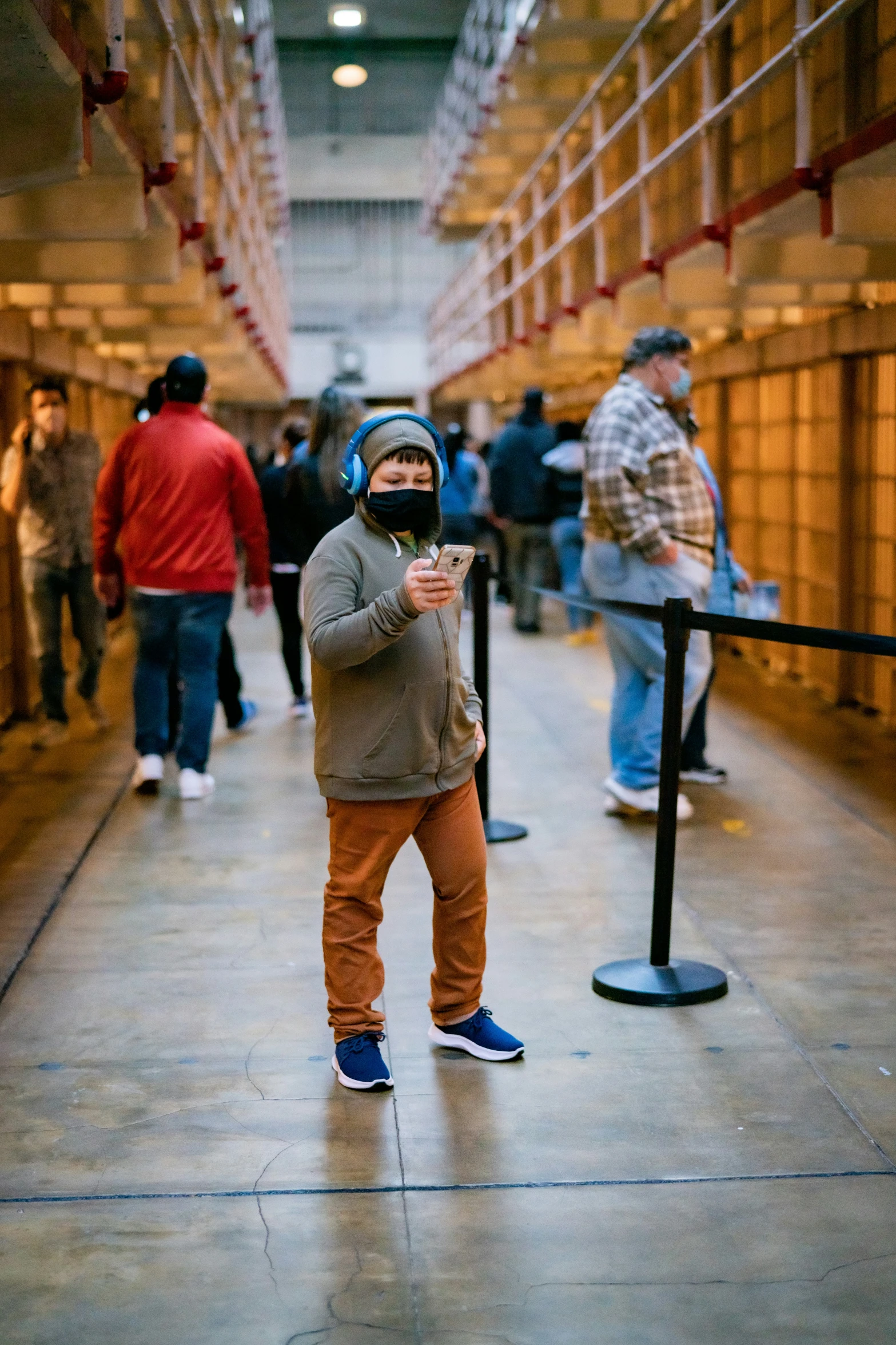 a boy looking surprised while standing in a line