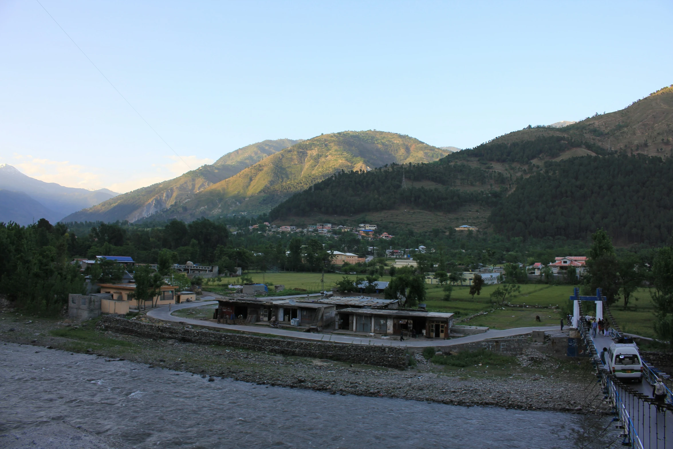 a village in the middle of mountains near a river