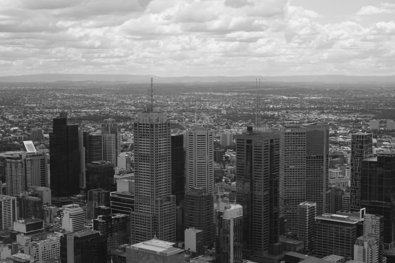 black and white po of city buildings and clouds