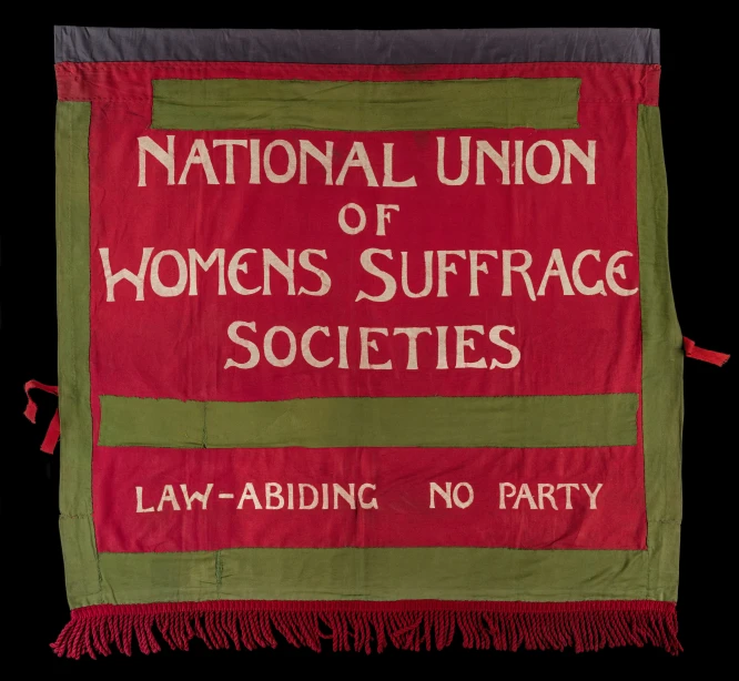 a national union of women's suffracc society banner hanging on the wall