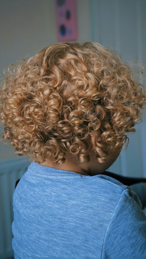 the curly haired child has curly hair