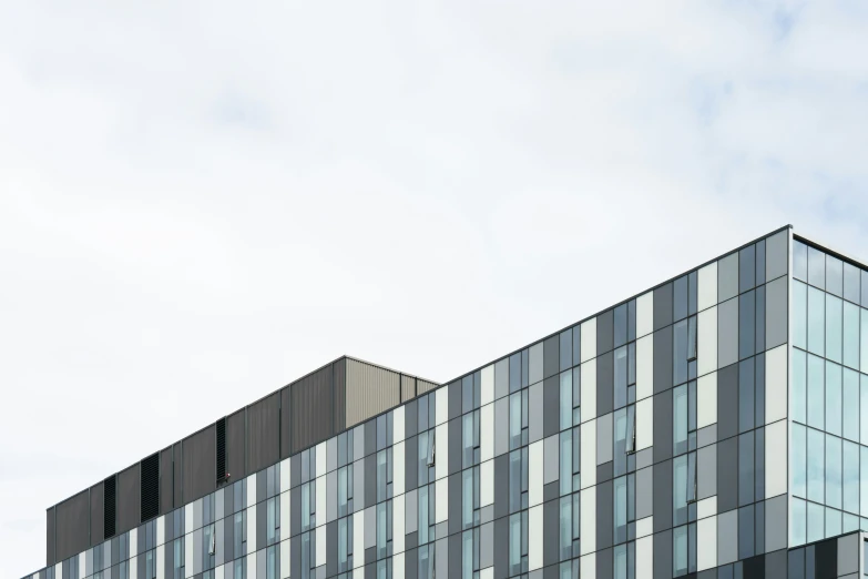 the front facade of an office building made of glass