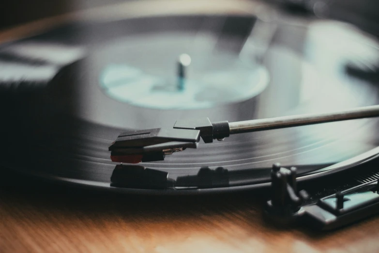 a record player is holding the turntable on top of a table