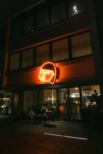 an image of a neon sign above a restaurant