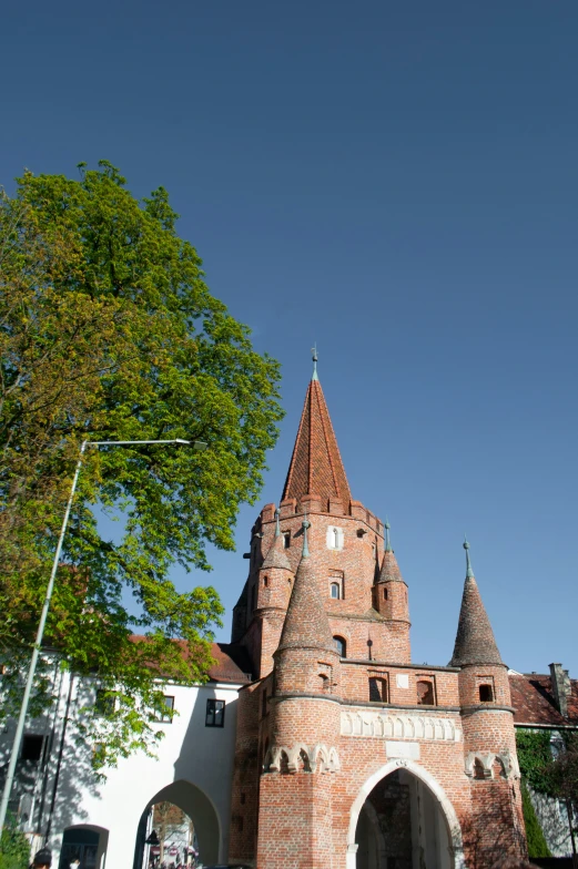 the cathedral is made of bricks with a clock on it