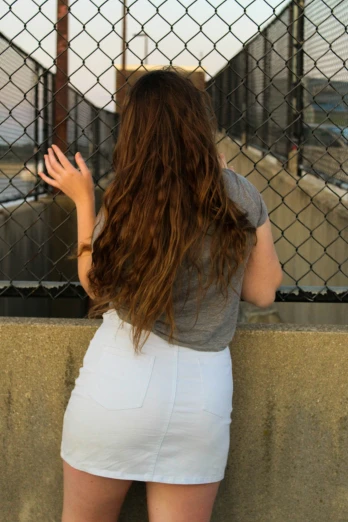 a woman holding her hands on the wall