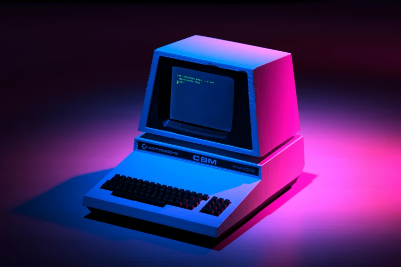 an old laptop sitting on a blue light