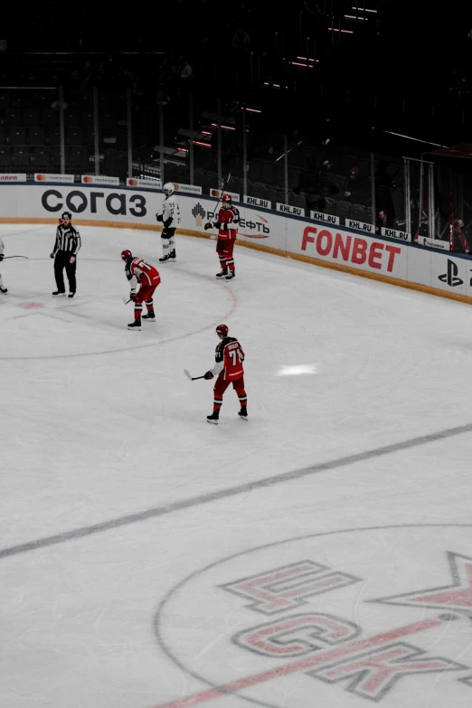 people are playing a game of hockey on an ice rink