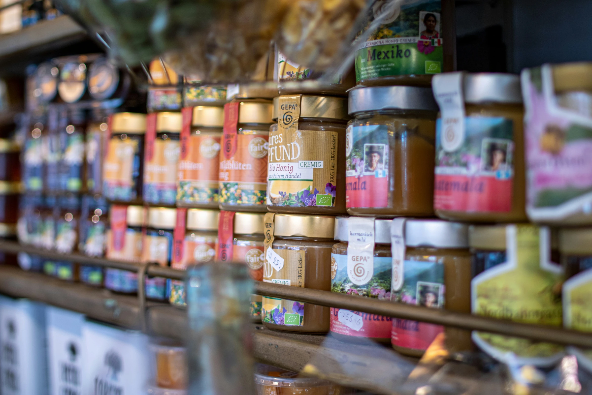 a store shelf filled with lots of jars of food