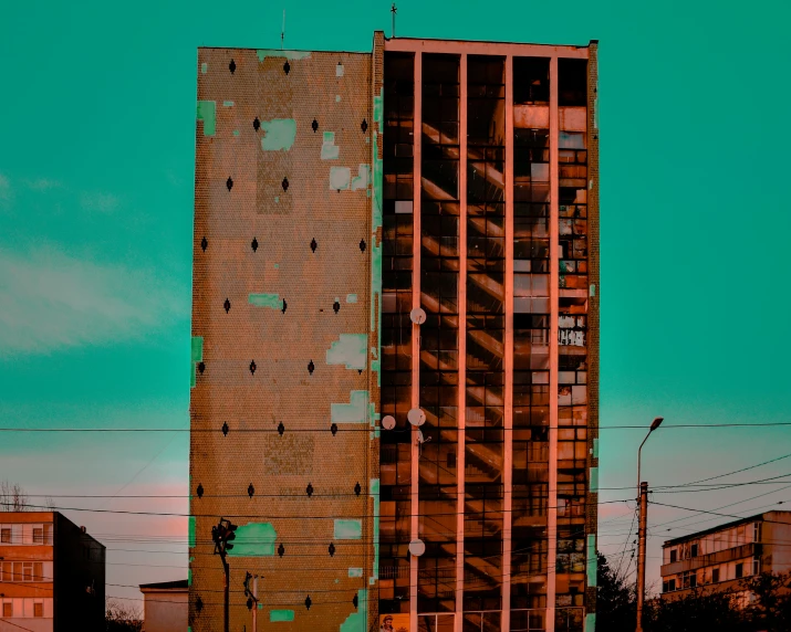 an apartment building is in the middle of an empty lot