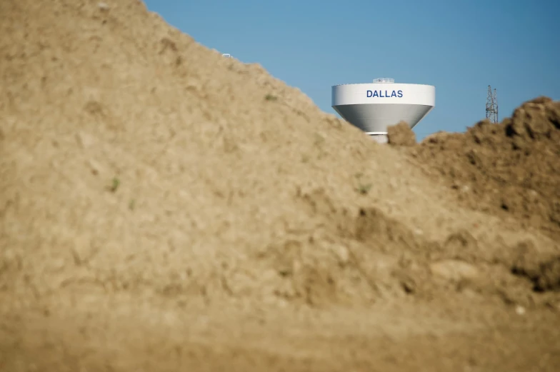 the ballas water tower is on top of a large mound of dirt