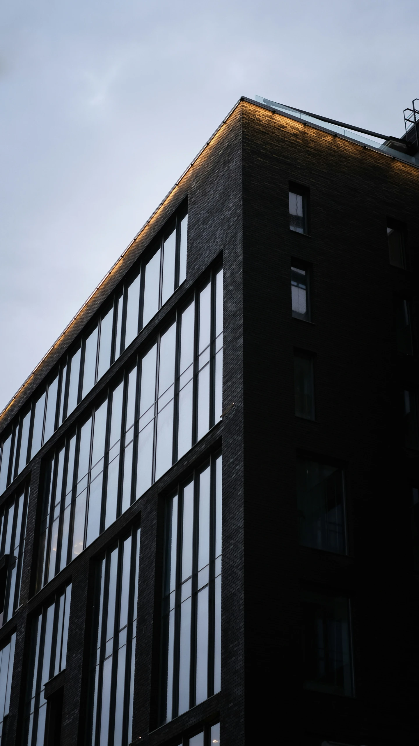 the side of an office building with many windows