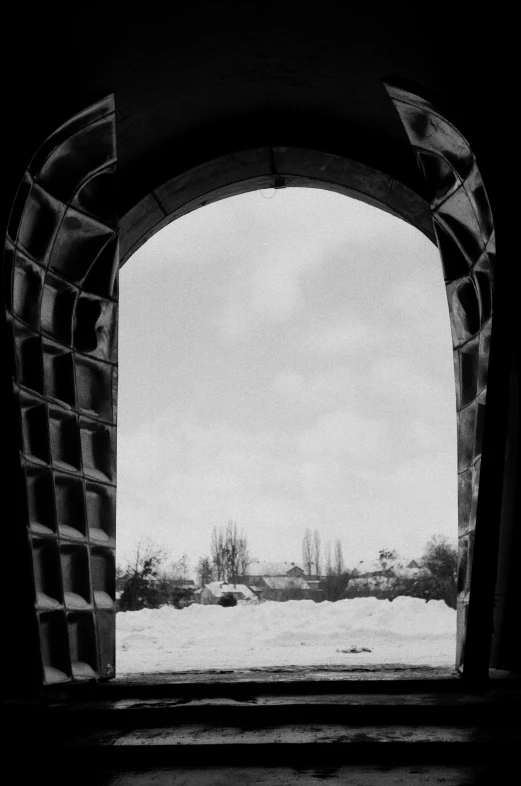 an open window and view to an empty field