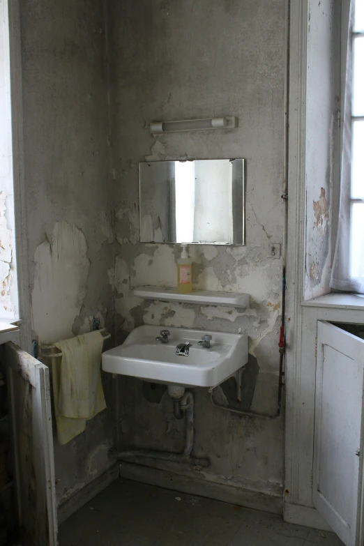 a sink and a window in a building