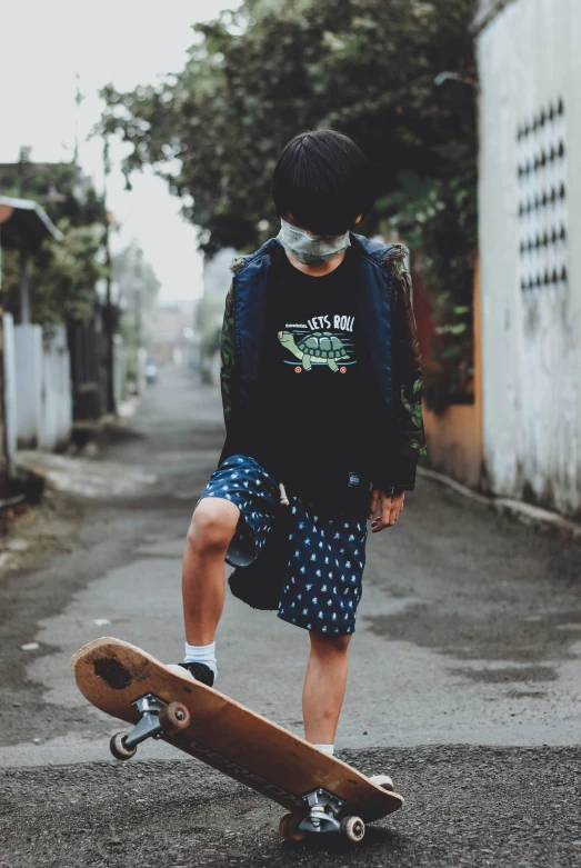 a skateboarder in a backpack rides on a street