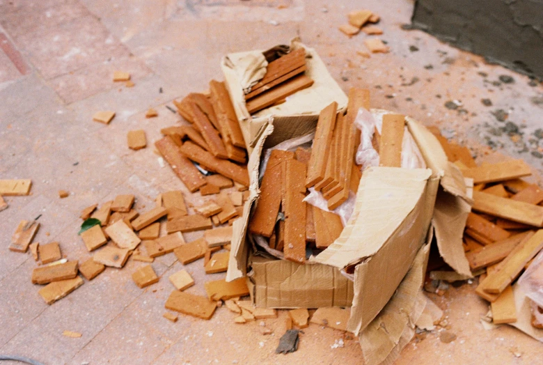 a group of broken boxes on the ground